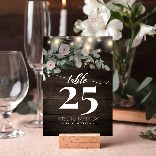 Rustic Wood String Lights Blush Floral Wedding Table Number (Rustic wood string lights floral design table number card is perfect for your wedding reception.)