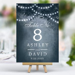 Rustic Woodland Tree String Lights Navy Blue Table Number<br><div class="desc">Light up your rustic wedding reception with these enchanting table numbers. Featuring a majestic woodland tree silhouette adorned with twinkling string lights against a serene blue backdrop, these table numbers add a touch of magic to your special day. Perfect for outdoor or indoor celebrations, they create a warm and inviting...</div>