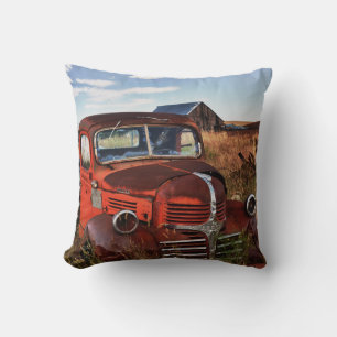 Rusting orange Dodge truck with abandoned farm Cushion