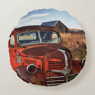 Rusting orange Dodge truck with abandoned farm Round Cushion
