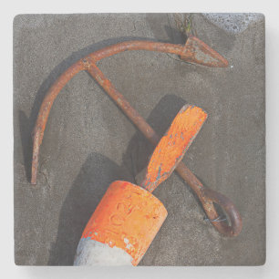 Rusty Anchor And Buoy On A Beach Stone Coaster
