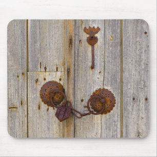 Rusty vintage old iron padlock on a wooden door - mouse mat