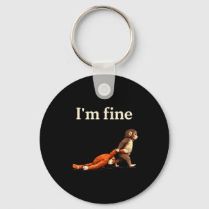 Sad monkey punch meme with an orange toy i'm fine key ring