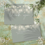 Sage Green Floral Greenery String Lights Thank You Card<br><div class="desc">Featuring delicate floral greenery, pretty string lights and an elegant thank-you script on a sage green background. You can personalise with your own thank you message on the reverse, or if you prefer to add your handwritten message, delete the text. A perfect way to say thank you! Designed by Thisisnotme©...</div>