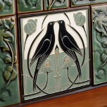 Sage Green Mackintosh Black Birds Art Deco Decor Tile<br><div class="desc">This ceramic tile features two black birds and intricate floral patterns reminiscent of the iconic style of Mackintosh. He was a prominent Scottish architect, designer, and artist of the Art Nouveau movement. Clean lines, geometric shapes, and a strong sense of symmetry characterise his work. These elements are beautifully represented in...</div>