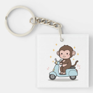 Said a monkey driving a scooter. key ring