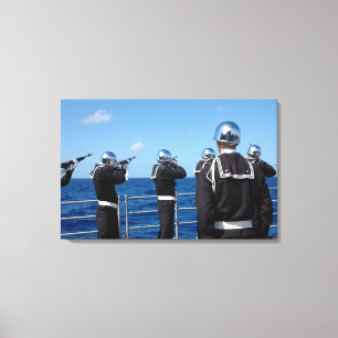 Sailors fire a gun salute during a burial-at-se canvas print