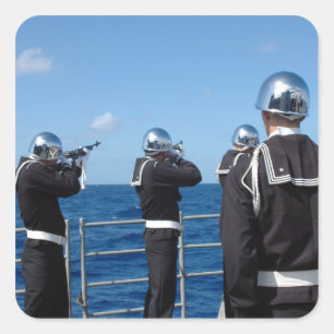 Sailors fire a gun salute during a burial-at-se square sticker