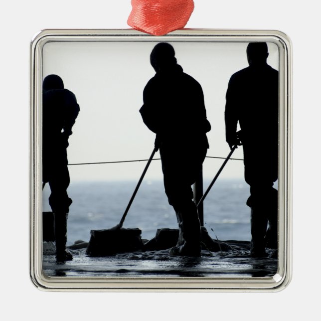 Sailors sweep out the hangar bay metal tree decoration (Front)