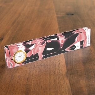 Salmon and black scraps, destroyed tapes on white nameplate