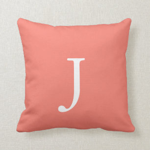 Salmon colored monogram throw pillow