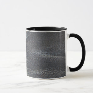 Sand dollar on sand mug