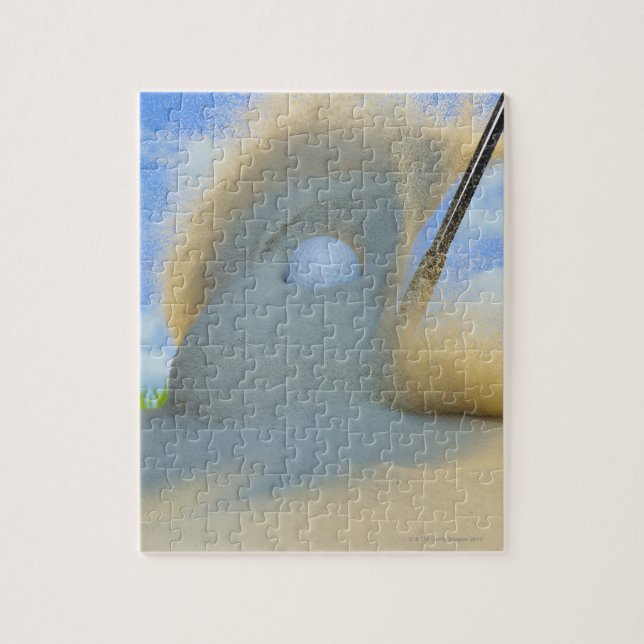 sand wedge hitting a golf ball out of a sand jigsaw puzzle (Vertical)