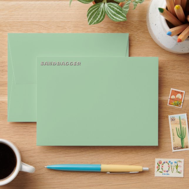 Sandbagger green small envelopes front top (Desk)
