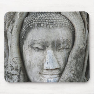 Sandstone head of Buddha surrounded by tree Mouse Mat