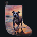 Sandy American Staffordshire Dog on Beach Sunset Small Christmas Stocking<br><div class="desc">Immerse yourself in the tranquil beauty of our "Sandy Paws and Sunset Hues" dog on beach sunset design. This captivating scene captures the essence of a perfect evening at the shore, with a loyal canine companion enjoying the golden sands and the breathtaking hues of the setting sun. Whether you're a...</div>