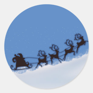 Santa and his reindeer classic round sticker