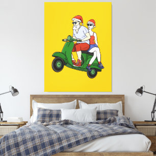 Santa and Mrs. Claus riding a scooter Canvas Print