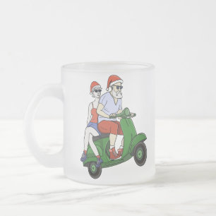 Santa and Mrs. Claus riding a scooter Frosted Glass Coffee Mug