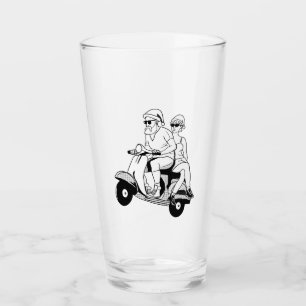 Santa and Mrs. Claus riding a scooter Glass