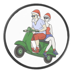 Santa and Mrs. Claus riding a scooter Hockey Puck