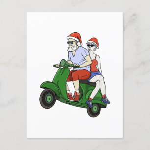 Santa and Mrs. Claus riding a scooter Postcard