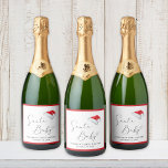 Santa Baby Christmas Baby Shower Sparkling Wine Label<br><div class="desc">Cute sparkling wine labels for your Christmas baby shower featuring "Santa Baby" in a chic script with a heart swash,  a watercolor of Santa's red hat,  and the name of the mummy-to-be and the shower date in simple topography.</div>