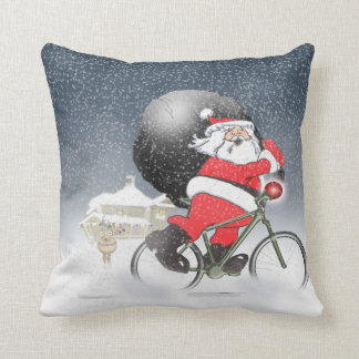 Santa bicycling with sack and snow pillow