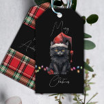 Santa Cat Kitten Christmas Red and Plaid Gift Tags<br><div class="desc">This dark and whimsical gift tag combines the charm of a black kitten with the festive spirit of Christmas. The front of the tag features a sleek black background that serves as a dramatic canvas for the design. At the centre of the tag, a playful black kitten steals the show....</div>