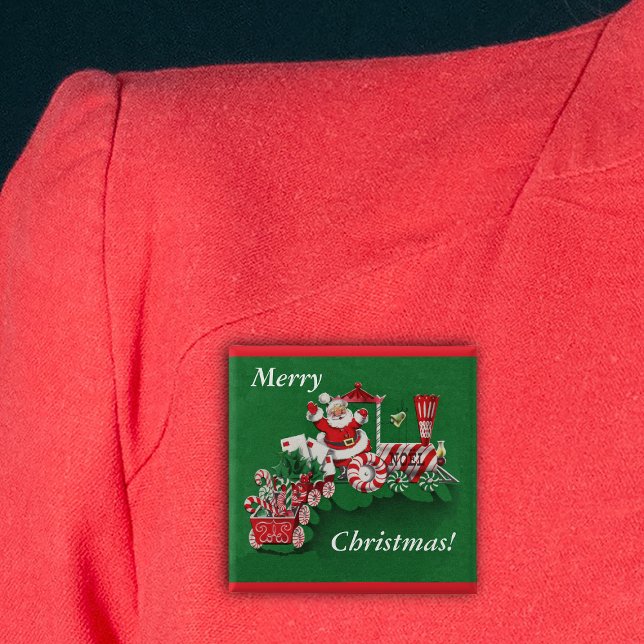 Santa Christmas Train Button (Santa riding train peppermint candy wheels candy canes Merry Christmas green pin back button.)