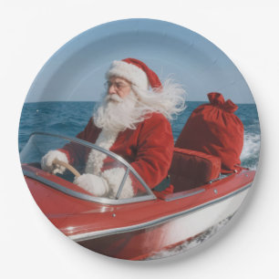 Santa Claus Delivering Gifts By Speedboat Paper Plate