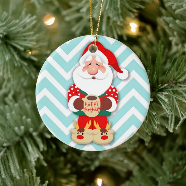 Santa claus in red pyjamas holding a mug ceramic tree decoration (Tree)