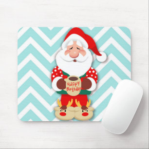 Santa claus in red pyjamas holding a mug mouse mat
