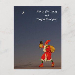 Santa Claus in the darkness with a lantern Holiday Postcard