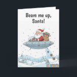 Santa Claus in UFO Christmas Card<br><div class="desc">Blast off into a holiday full of fun with this whimsical Christmas card. Featuring Santa Claus piloting a UFO, he’s dropping presents straight down the chimney in a cosmic twist on a classic tradition. Perfect for anyone who loves quirky, out-of-this-world holiday cheer, this card is sure to bring smiles, laughter,...</div>