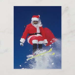 Santa Claus on skis jumping off a cornice at Holiday Postcard
