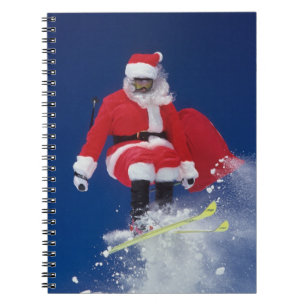 Santa Claus on skis jumping off a cornice at Notebook