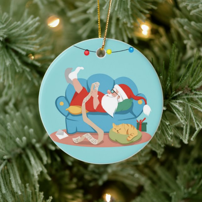 Santa Claus on the couch in pajamas Ceramic Tree Decoration (Tree)