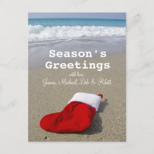Santa Claus sock laying on beautiful beach Holiday Postcard
