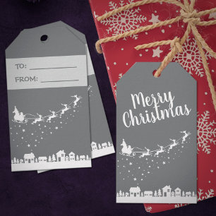 Santa Claus w/ sleigh & reindeers above the houses Gift Tags