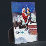 Santa Delivering Books Christmas Eve Plaque<br><div class="desc">Santa delivering books on Christmas Eve,  popular vintage painting by N.C. Wyeth</div>