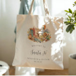 Santa Fe New Mexico Desert Wedding Welcome Tote Bag<br><div class="desc">A warm, hand-painted watercolor tote featuring a curated Santa Fe vignette filled with adobe architecture, turquoise accents, desert botanicals, pottery, and a soft Southwest sunset palette. Designed as a chic welcome gift for your Santa Fe bachelorette weekend, this tote feels equal parts artful and practical. Personalized with the couple’s names...</div>