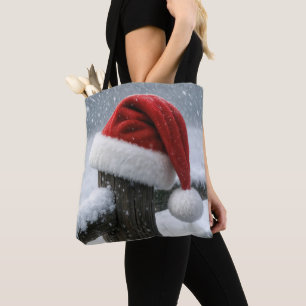 Santa Hat On a Snowy Fence Post Tote Bag