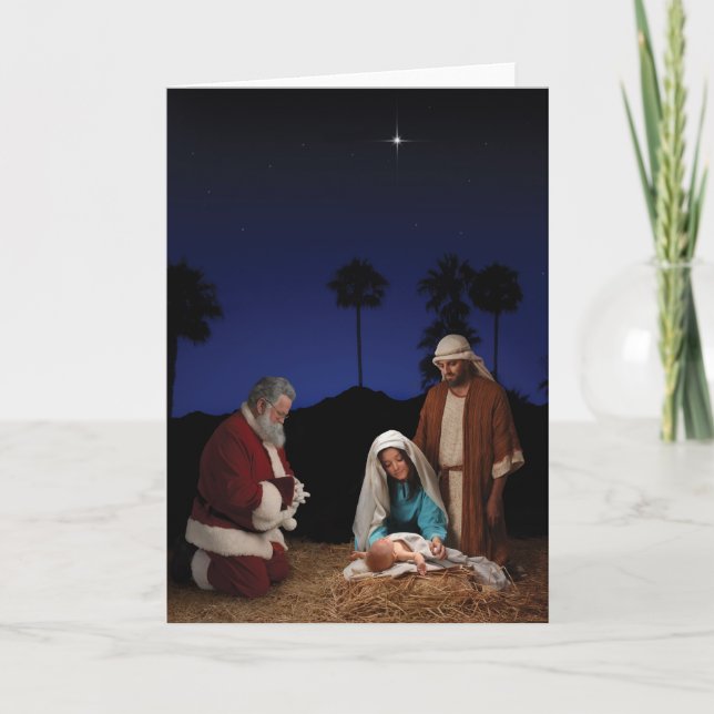 Santa Kneeling at Nativity Holiday Card (Front)