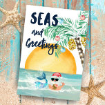 Santa Mermaid Beach Fun Jokes Christmas Tri-Fold Holiday Card<br><div class="desc">Share some fun & festive greetings with this tri-fold Christmas card featuring a beach-themed Christmas word find game, and jokes and a watercolor seascape that includes Santa, a mermaid, whale, ship, and palm tree Christmas trees. The front cover features a mermaid and Santa (with a tropical pineapple drink) in the...</div>