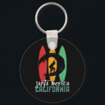 Santa Monica Beach California Retro Surfing Key Ring<br><div class="desc">Vintage retro surfboard design for surfers who love surfing and riding the ocean waves. Cool summer holiday, spring break merchandise for those who enjoy hot sun, tropical weather, sunbathing under the palm tree. Grunge and distressed design to wear while enjoying the beach party and singing around the bonfire. Great souvenir,...</div>