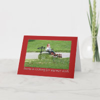Santa on a riding lawn mower  landscaper