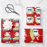 Santa surfing cool shades on red Christmas gift  Wrapping Paper Sheet<br><div class="desc">A trio of gift wrap, each with a different design on is ideal for your blue and white summer heat Christmas theme. The first sheet has Father Christmas riding on a surfboard across the top of blue waves wearing his Santa hat and black belt with red shorts. The second has...</div>