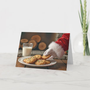 Santa Taking a Cookie By the Fireplace Holiday Card
