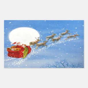 Santa with his flying Reindeer Rectangular Sticker